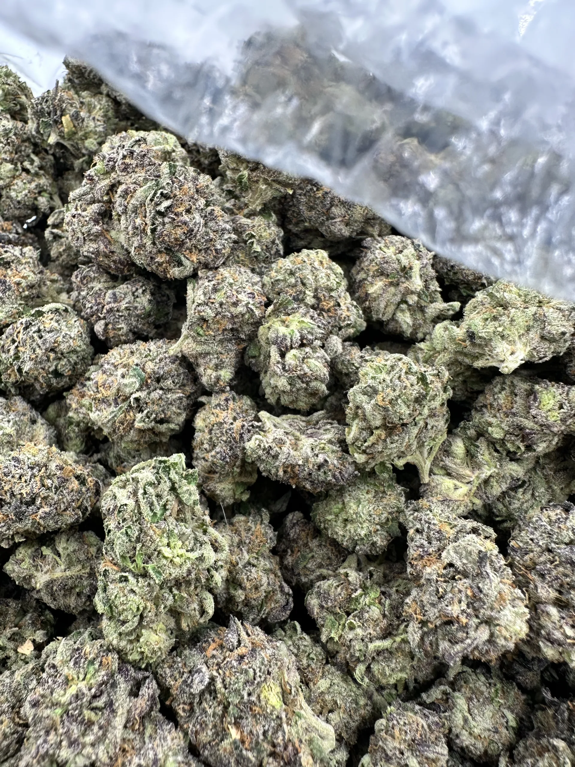 Blueberry Cheesecake top-shelf premium flower with dense buds and crystalline trichome frosting
