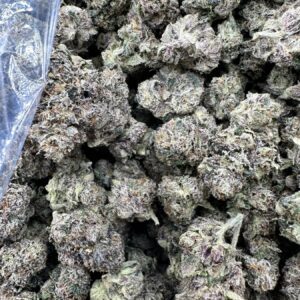 Gushers top-shelf indica flower macro showing premium trichome frost, dense calyx layering, and refined bud structure
