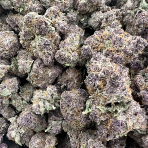 Tropicana Cherry top-shelf flower with dense frosty buds, purple-cream coloration, and prominent amber trichome accents