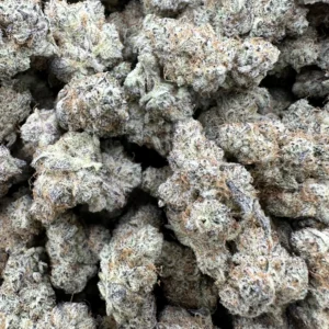 Aloha Sugar top-shelf flower macro showing curated dense buds with refined silvery-white frost and warm tan-brown flower undertones
