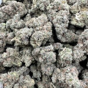 Pineapple Express top-shelf flower displaying refined frosted buds with dense trichome coverage and elevated calyx structure