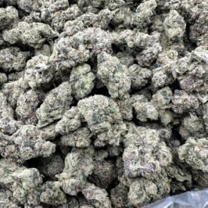 Poprocks strain top-shelf flower with refined frost-covered buds and dense trichome crystalline structure