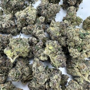 Stuntz strain top-shelf flower macro displaying terpene-rich buds with heavy trichome frosting and refined calyx structure