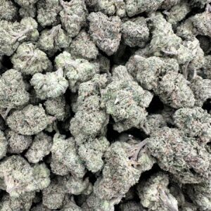 Cherry Bomb top-shelf flower macro showcasing hand-selected buds with refined trichome frost and premium calyx density